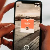 close up of a phone showing the snapchat app in use on the camera menu