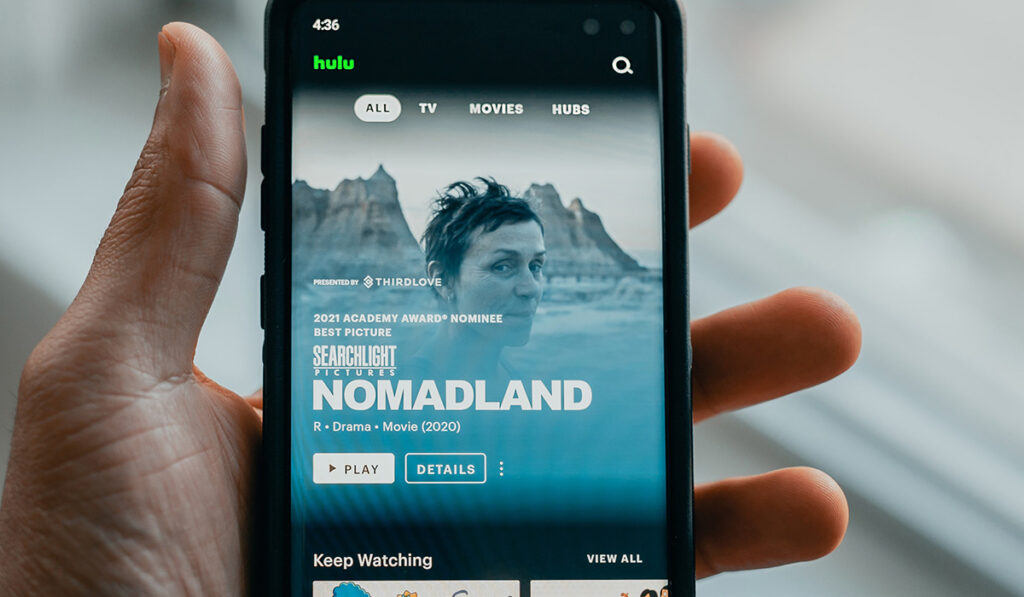 close up of iphone showing hulu homepage