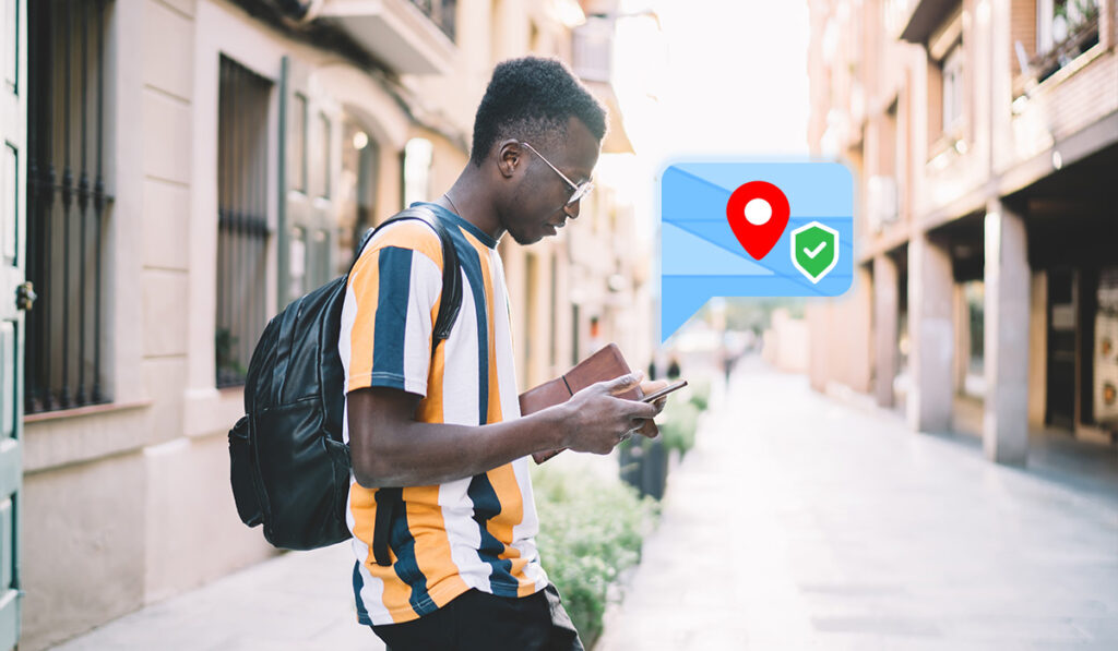 man in street with a location popup over his phone