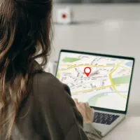 woman with laptop searching a location