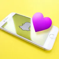 CGI rendering phone with the Snapchat logo with a purple heart