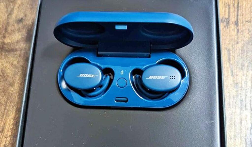 Close up of blue Bose earbuds in their case