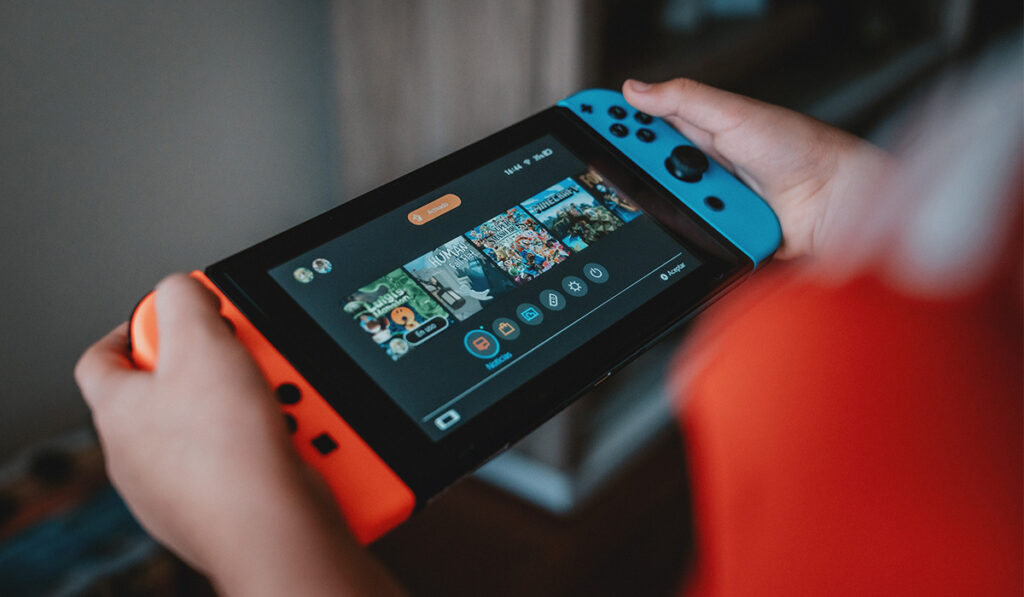 Nintendo Switch with home screen showing different games
