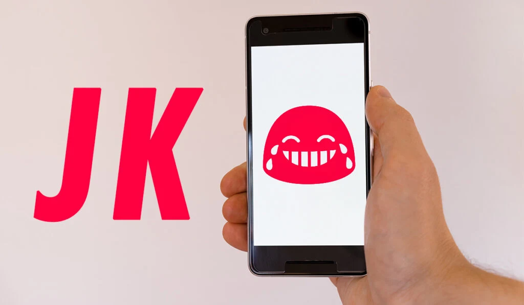 Text JK next to phone showing laughing emoji