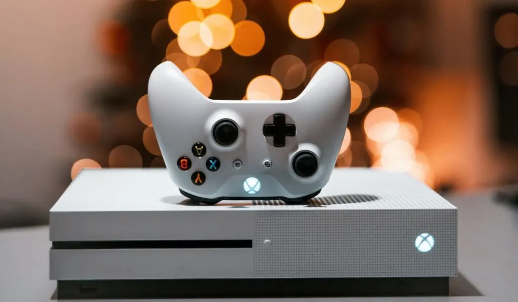 White Xbox one S console with a controller