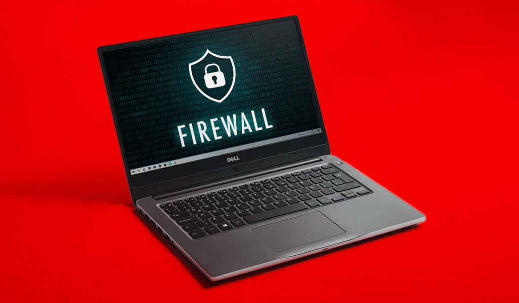 Dell laptop displaying an image with code and the word 'fire wall' with a lock icon